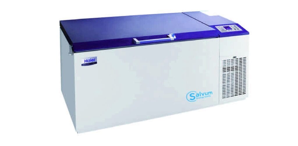 A long, rectangular, white Haier medical chest freezer with a dark blue lid and a control panel on the right side.