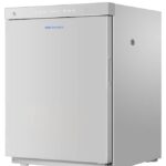 A small, white Haier medical refrigerator with a solid door, a digital display on top, and a circular lock on the top left.